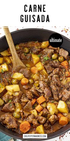 a pot filled with beef and potatoes next to a wooden spoon