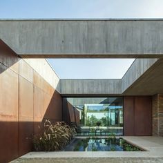 an outdoor swimming pool in the middle of a house