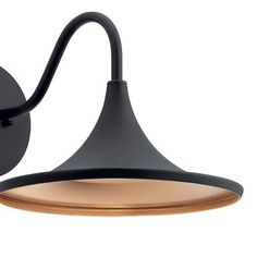 a black wall light with a brown shade on the side and a white back ground