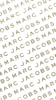 the word marc on a white background with gold foiled letters and small black dots