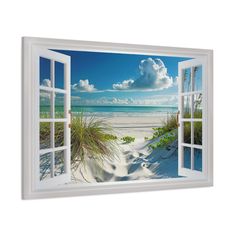 an open window looking out onto the beach and ocean with sand dunes in the foreground