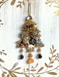 a christmas tree ornament hanging on a wall