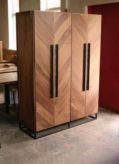 a large wooden cabinet sitting in the middle of a room