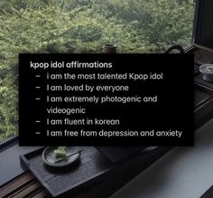 a window sill with a sign on it that reads, i am not affirmations