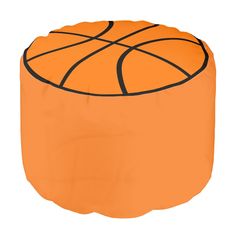 an orange and black ball sitting on top of a round ottoman cover with a basketball drawn on it