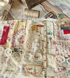 an assortment of fabric and threads laid out on top of a piece of cloth