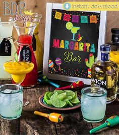 the margarita bar is ready to be served at your next party or event with drinks and condiments