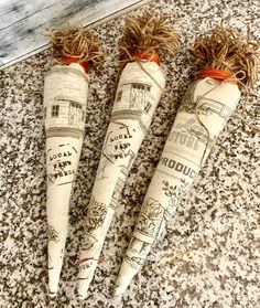 three carrots are wrapped in twine and tied with jumbo - rafters