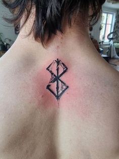 a person with a tattoo on their back