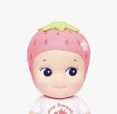 a small toy with a pink strawberry on it's head and the words love sweet is