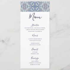 a menu card with blue and white designs on it