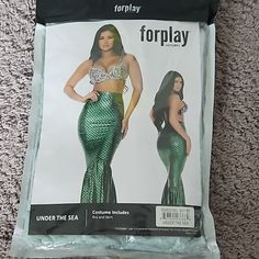 the front and back of a green sequinized mermaid costume with an open bra