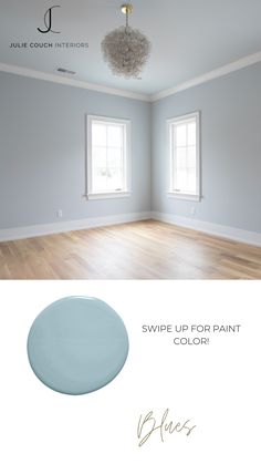 an empty room with white walls and wood floors, the color is swipe up for paint