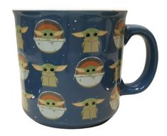 a blue coffee mug with baby yoda and other images on the inside of it