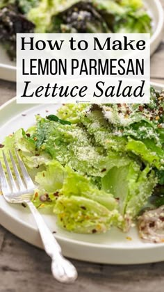 two white plates filled with lettuce salad on top of a wooden table