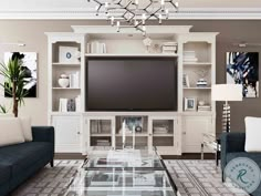 a living room filled with furniture and a flat screen tv on top of a entertainment center