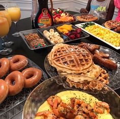 a table topped with lots of different types of breakfast foods