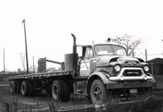 black and white photograph of an old truck