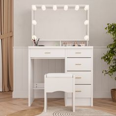 a white dressing table with lights on it