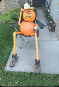 a lawn chair with a pumpkin sitting on it's legs and wearing a cowboy hat