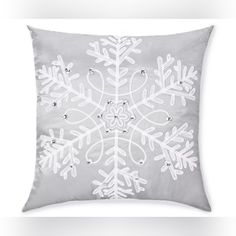 a snowflake pillow on a white background