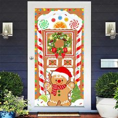 a christmas door cover with a ginger bear and candy canes in front of it