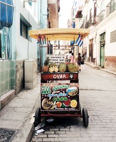 a food cart parked on the side of a street