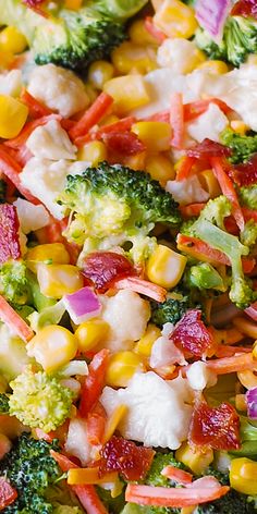 a salad with broccoli, corn and other vegetables