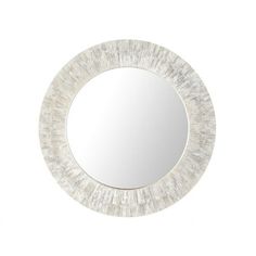 a white round mirror on the wall with an oval frame and wood grain pattern around it