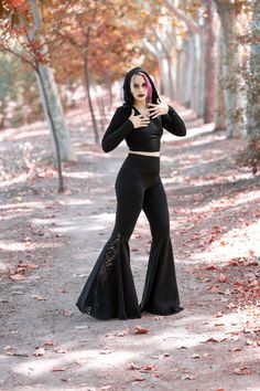 Edgy Flare Pants For Party, Black Flares For Fall Party, Fitted Black Wide Leg Pants With Flared Hem, Black Full Length Flares For Party, Black Fitted Wide Leg Pants With Flared Hem, Gothic Black Flare Bottoms, Alternative Style Stretch Pants For Fall, Black Flared Hem Pants For Party, Stretch Gothic Bottoms For Cosplay