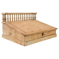 an old wooden bed frame with rails on top