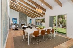 Chic modern open plan Beverly Hills ranch home dining & living rooms with artistic design elements, wood beam ceiling & airy natural light. Home Dining Room, Built In Grill