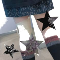 the legs and ankles of a person wearing socks with stars on them