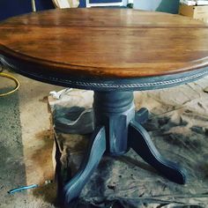 a wooden table sitting on top of a hard wood floor