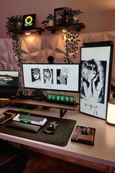 two computer screens sitting on top of a desk next to a keyboard and mouse pad