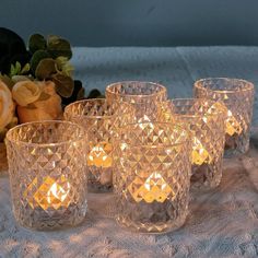 a set of six clear glass tealight candles