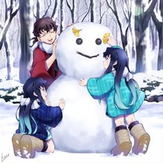 two girls are standing next to a snowman