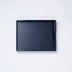 a flat screen tv mounted to the side of a wall