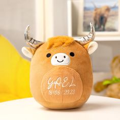 a stuffed animal with horns on it's head