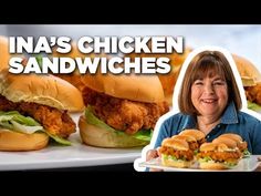 a woman holding a plate with chicken sandwiches on it and the caption ina's chicken sandwiches