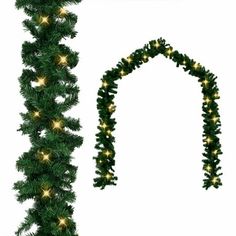 a christmas garland with lights hanging from it's side and an arch in the background