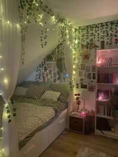 a bedroom decorated in white and green with lots of lights