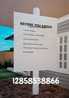 a sign that has been placed in front of a house with the words before you knock on it