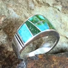 This beautiful Sterling Silver Ring showcases the spectacular Green, Blue and Yellow hues of Sonoran Gold Turquoise from Mexico.. Ring Width: 7/16"; Shank Width: 1/8" The ring is designed by David Rosales, one of the finest contemporary Southwest Artists in the world. He is the founder and co-owner of Supersmiths, Inc. of Gallup, NM. Each ring is custom made and carries a lifetime guarantee. . Contemporary Southwest, Yellow Hues, Black Arrow, Southwest Jewelry, Jewelry Designer, Blue And Yellow, American Made, Sterling Silver Ring, Native American