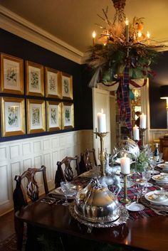 a dining room table is set for christmas dinner