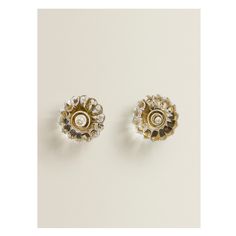 two pairs of gold and crystal earrings on a white background with space for text or image