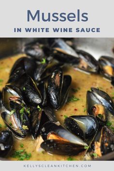 mussels in white wine sauce with parsley garnish on the side