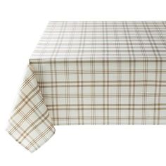 a plaid tablecloth on a white background with a brown and tan checkered design