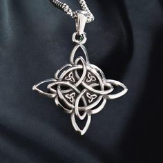 Witches knot amulet | gothic gift  Product Details:   - Pendant Size: 3.5 x 3.8 cm, designed with intricate Celtic knotwork   - Material: Durable stainless steel for long-lasting wear   - Styles: Available in 4 unique designs to suit various preferences   - Style: Gothic and Wiccan-inspired, symbolizing protection and spiritual connection   - Ideal for: Fans of mystical jewelry, Wiccan practitioners, or as a thoughtful anniversary or special occasion gift   Delivery Information:   - Processing Time: 2-5 days   - Estimated Delivery: 7-20 days, depending on location   This witches knot amulet offers a meaningful and stylish accessory for those who appreciate Celtic or Wiccan symbolism, making it a versatile gift for him or her. Witches Knot, Celtic Necklace, Mystical Jewelry, Wiccan Jewelry, Gothic Gifts, Celtic Knotwork, Style Gothic, Gift Delivery, Wire Crafts