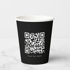 a black and white cup with a qr code printed on it's side